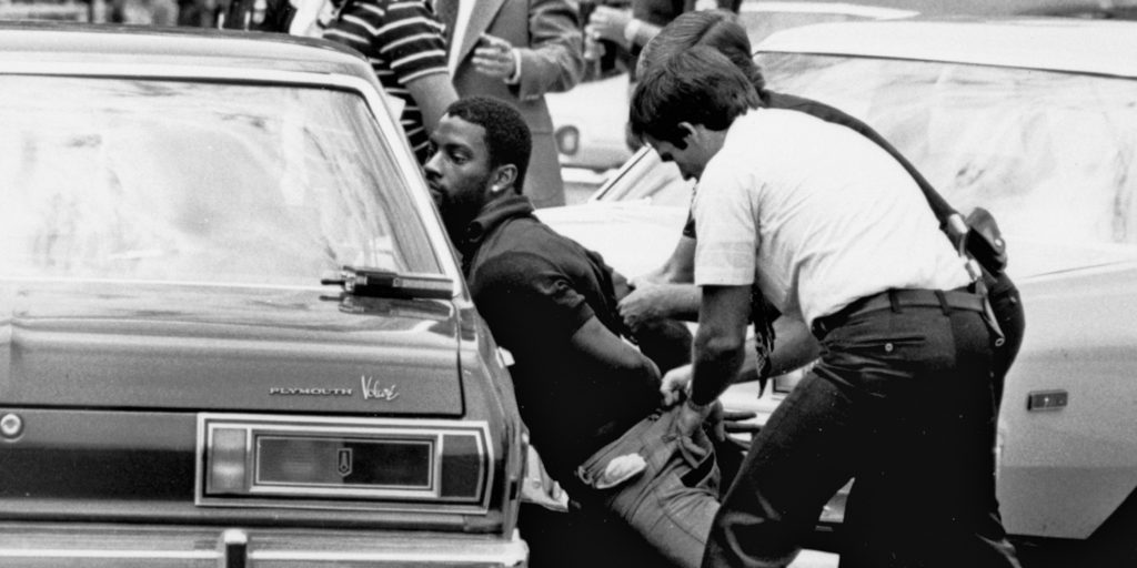 FILE - In this May 18, 1979 file photo, police handcuff a suspect during a drug raid in Miami. Police said eight were arrested and marijuana was seized. On the occasion of Legalization Day, Thursday, Dec. 6, 2012, when Washingtons new law takes effect, AP takes a look back at the cultural and legal status of the evil weed in American history. (AP Photo/Al Diaz, File)